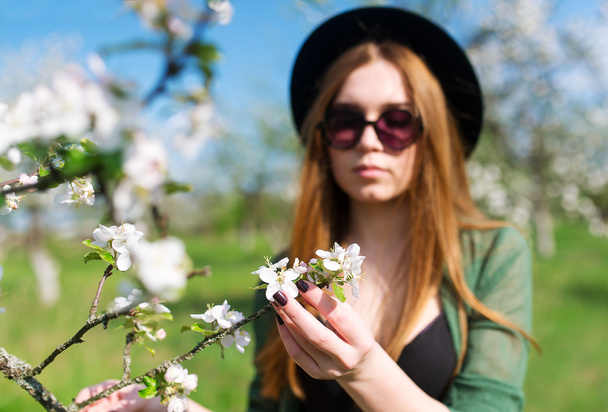 The girl model in an apple tree garden. - Photo, Image