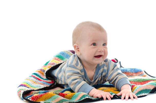 Sweet baby boy on colorful blanket crying isolated on white back - 写真・画像