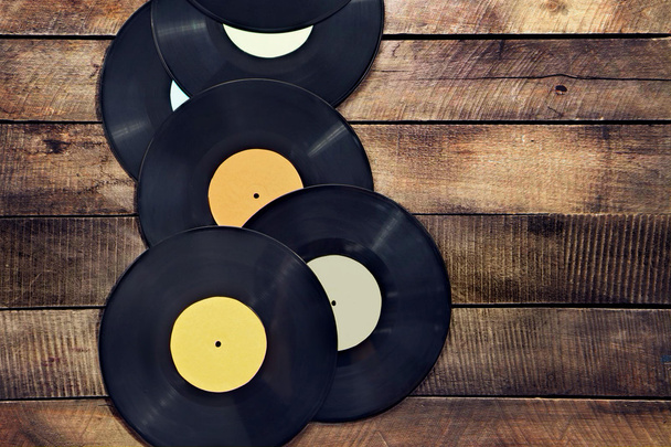 Vinyl records on wooden table - Zdjęcie, obraz