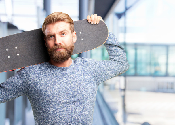 blonde man with skateboard - Fotoğraf, Görsel