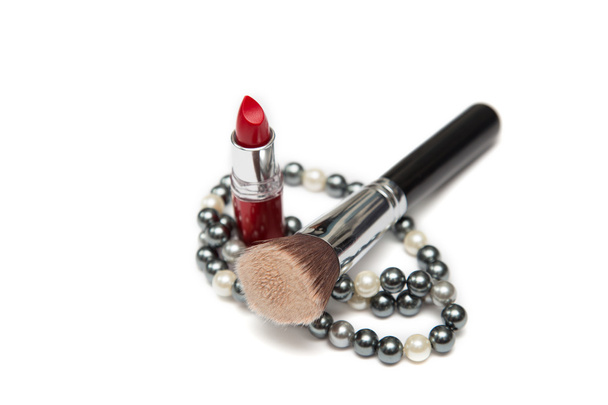 Pearl necklace, lipstick and make-up brush on it closeup - Valokuva, kuva