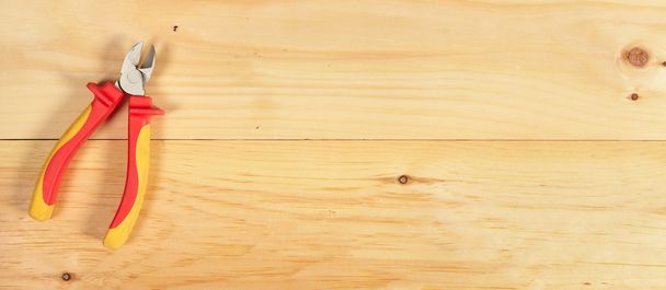 Pliers wrench on wooden background - Фото, зображення