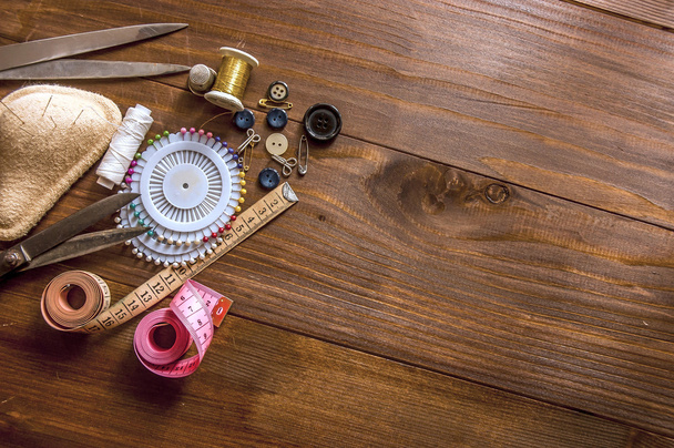 Sewing kit on the wooden background - Foto, Imagem