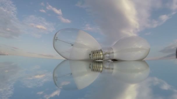 Two white transparent light bulbs on mirror, time lapse 4K - Footage, Video