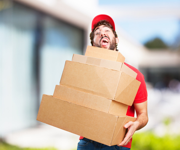 young crazy man with boxes - Foto, imagen