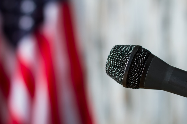 Microphone on blurred flag background. - Foto, imagen