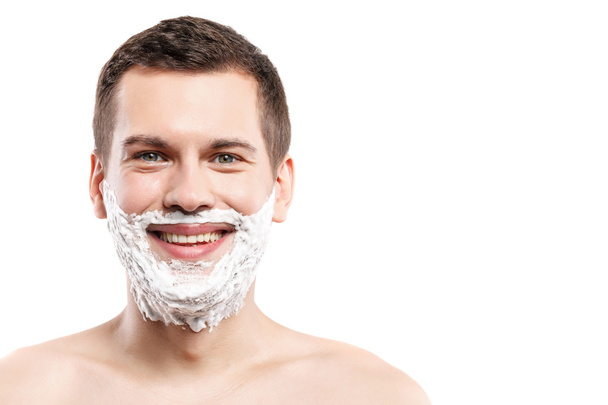 Attractive guy with shaving foam on face - Fotó, kép