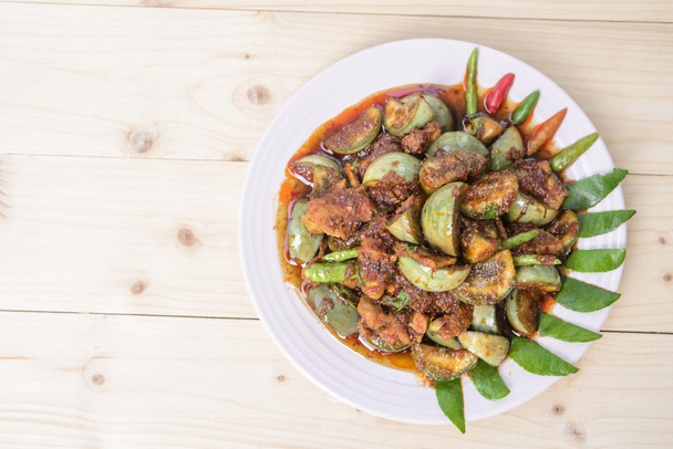 Thai food; Pork with eggplant in Thai spicy chilli sauce; Wood background and texture - Zdjęcie, obraz