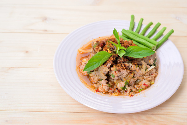 Thai food; Lab-Moo; Chopped pork mix with Thai spicy curry; wood background - Zdjęcie, obraz