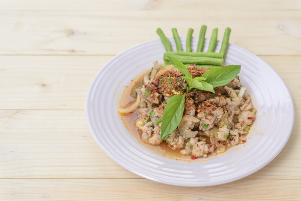 Thai food; Lab-Moo; Chopped pork mix with Thai spicy curry; wood texture background - Zdjęcie, obraz