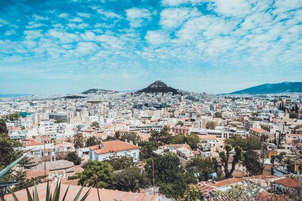 Scenic Overview of Mediterranean City of Athens with Landmark Mountains on Sunny Day with Cloudy Blue Sky, Athén, Görögország - Fotó, kép