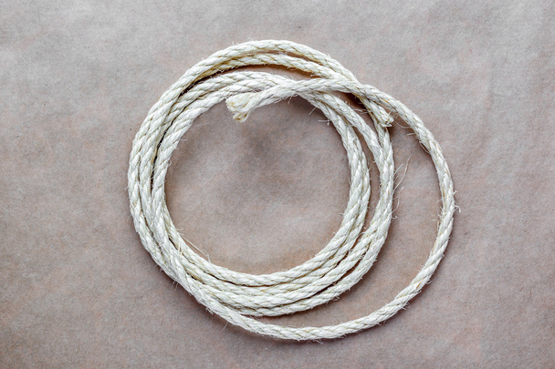 rope coiled at kraft paper on the background - Фото, зображення