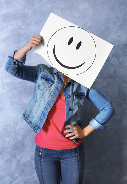 Woman showing a happy emoticon - Foto, Imagen