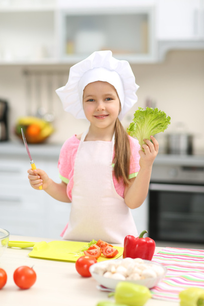 Little girl preparing food - Фото, изображение