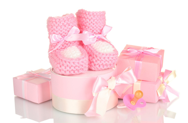 Pink baby boots, pacifier and gifts isolated on white - Zdjęcie, obraz