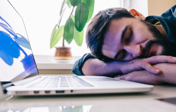Man sleeping with his laptop - Zdjęcie, obraz