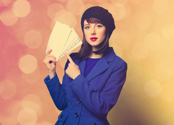 woman in blue dress with envelopes - Fotografie, Obrázek