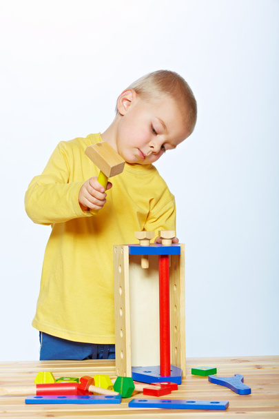 Boy with toy hammer - Фото, зображення