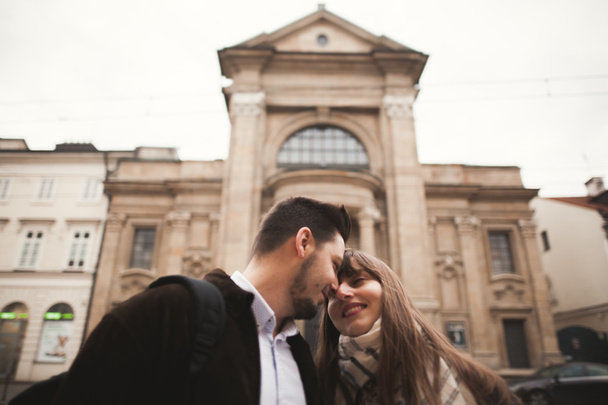 Loving couple posing in the old town - 写真・画像