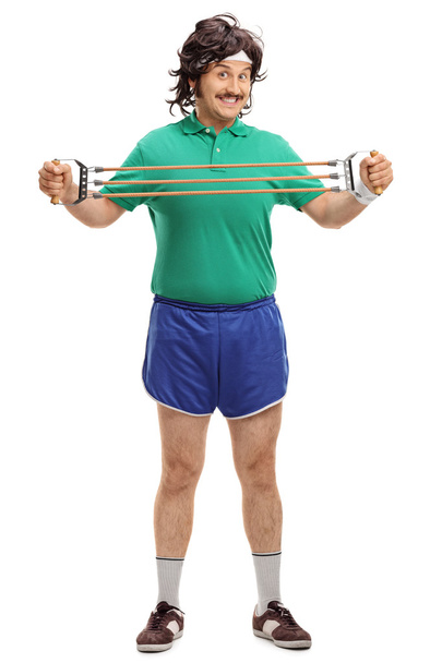 Retro guy exercising with retro equipment  - Foto, imagen