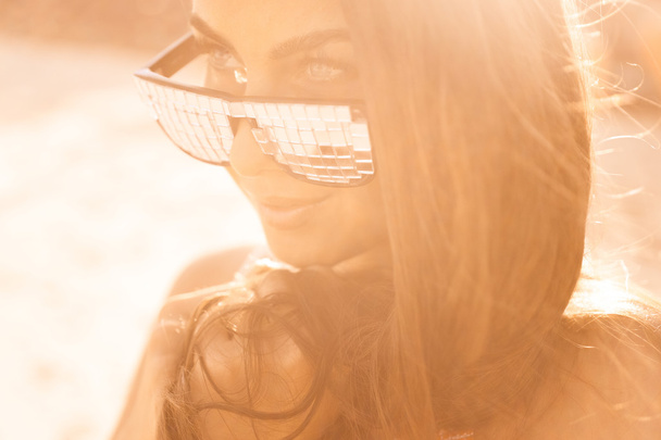 portrait of a beautiful young brunette girl in sunglasses   - Fotografie, Obrázek