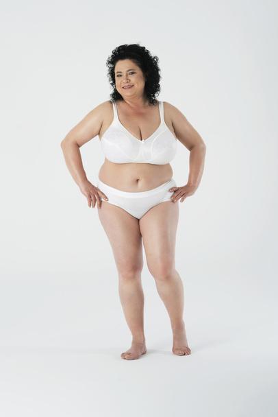 Confident woman standing in underwear - Фото, зображення