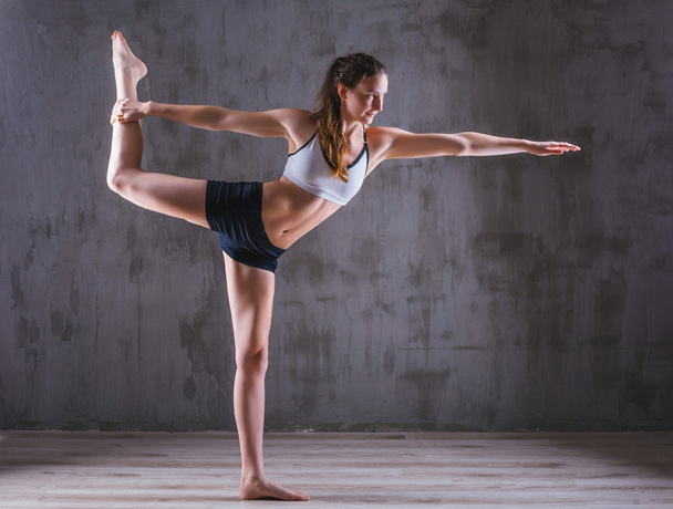 Sport yoga woman posing in photostudio. Fitness motivation picture - Фото, зображення