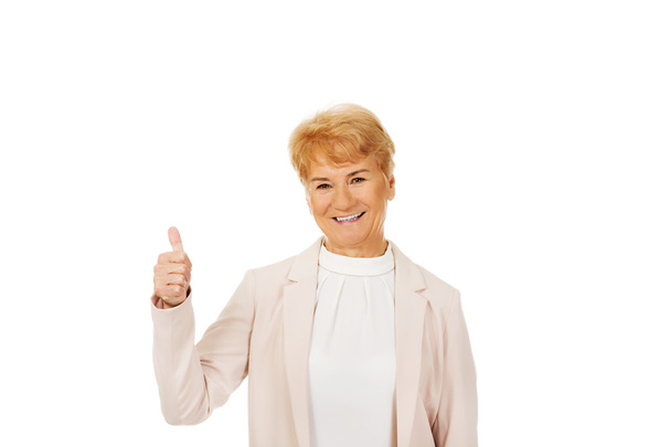 Smile elegant senior woman showing thumb up - Photo, Image