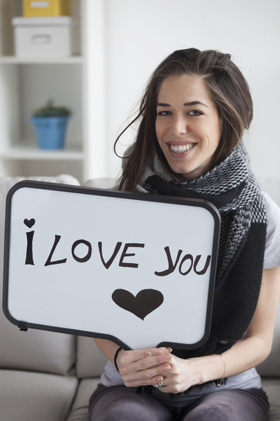 woman holding white board with 'I love you' - Foto, Imagen