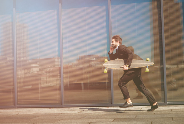 Businessman running on street - Foto, immagini