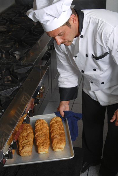 Chef with fresh bread - Fotoğraf, Görsel