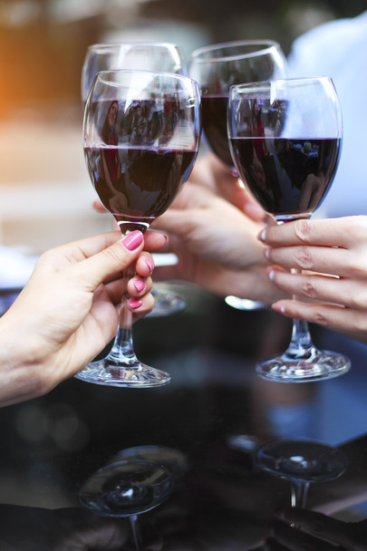 Close up of hands of a friends toasting - Photo, Image