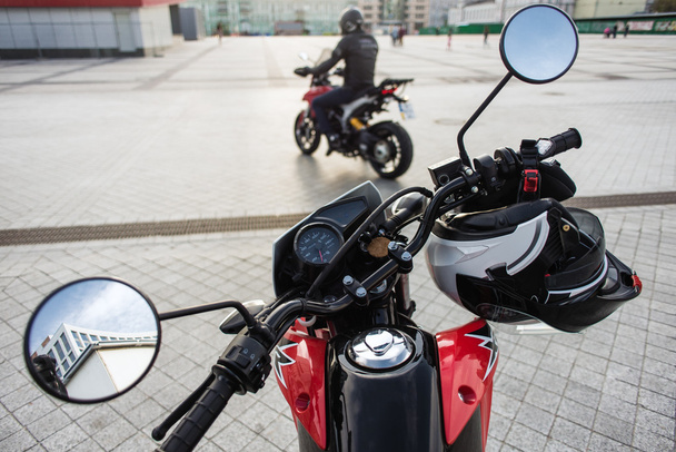 Kyiv, Ukraine - April 27th, 2016: Red motorcycle Honda XR 150 Lake and Ducati Hyperstrada at the city street. - Фото, изображение