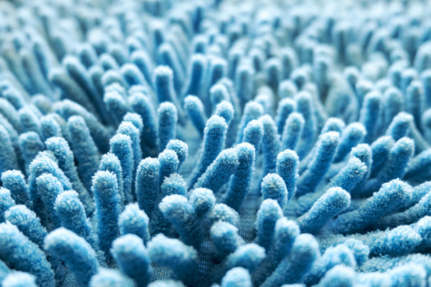 Kék szőnyeg lágy textúra a lábtörlő, válassza ki a közeli fókusz a kép. - Fotó, kép