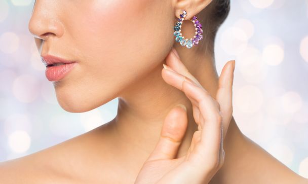 close up of beautiful woman face with earring - Fotoğraf, Görsel