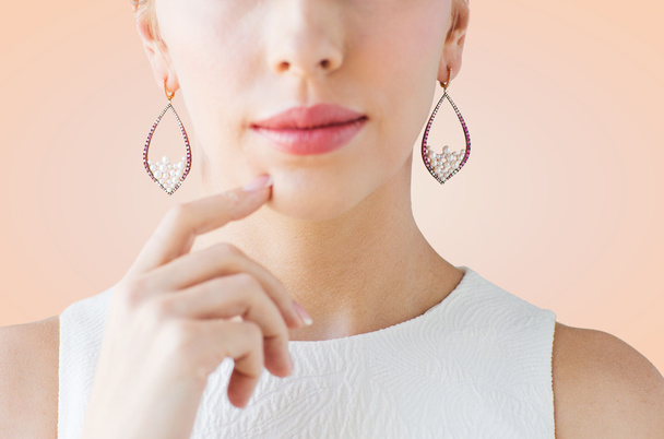 close up of beautiful woman face with earrings - Fotoğraf, Görsel