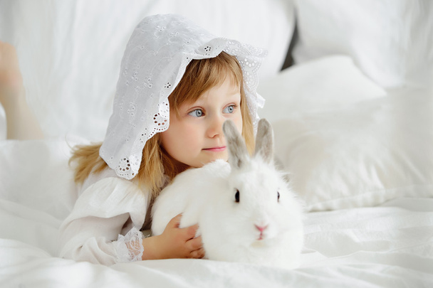 little girl with a rabbit - 写真・画像