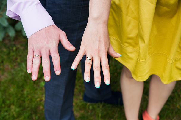 Closeup view of married couple holding hands - Photo, Image