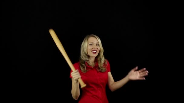 Girl with a baseball bat. Business lady. Business manager. Role-playing games. Woman dominates. Strong independent woman. Black background.  - Footage, Video