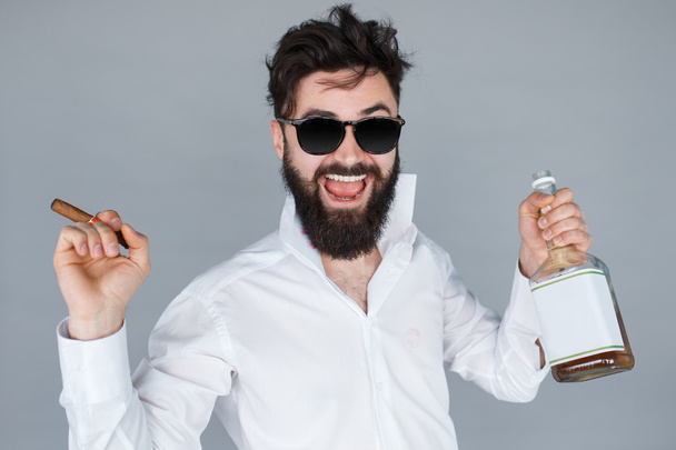man with bottle of whiskey and cigar  - Foto, afbeelding