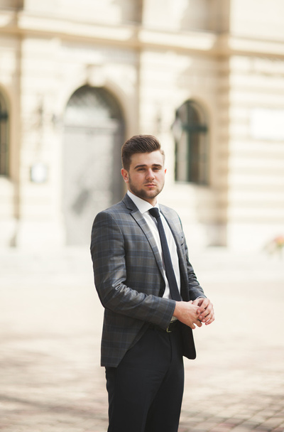 Handsome stylish young businessman posing portrait outdoor - Fotografie, Obrázek