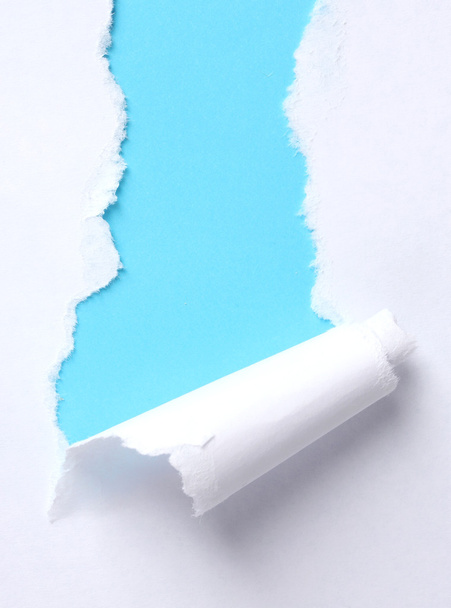Torn paper with blue background - Foto, immagini