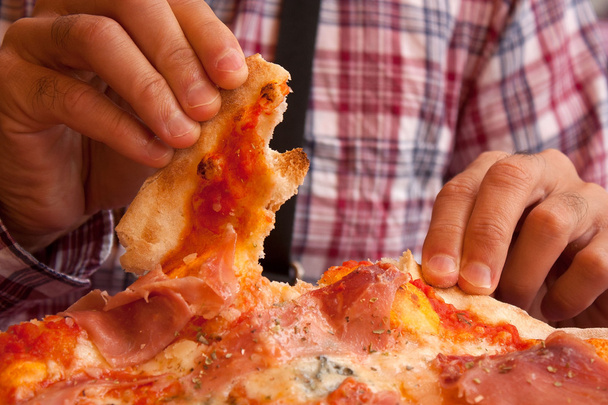 Eating italian pizza with hands - Photo, Image