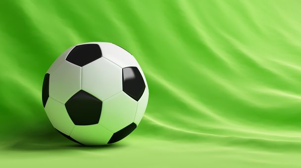 緑の背景にサッカー ボール - 写真・画像