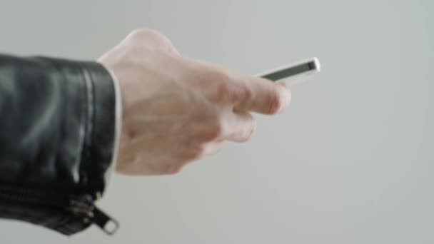 mans hand with smart phone - Materiaali, video