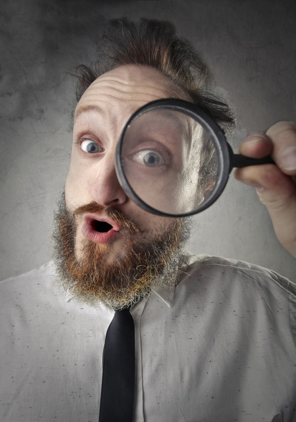 Man with magnifying glass - Foto, imagen