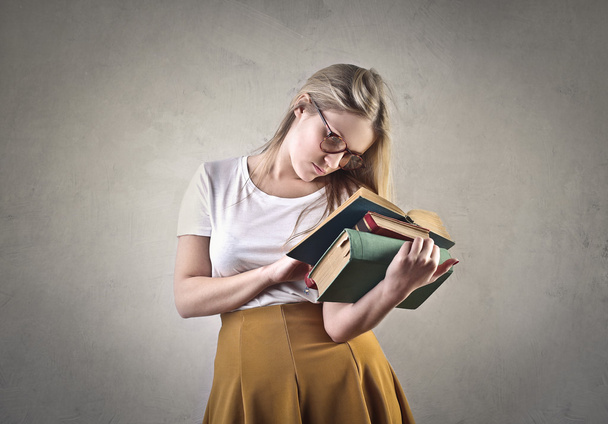 Girl reading books - Фото, изображение