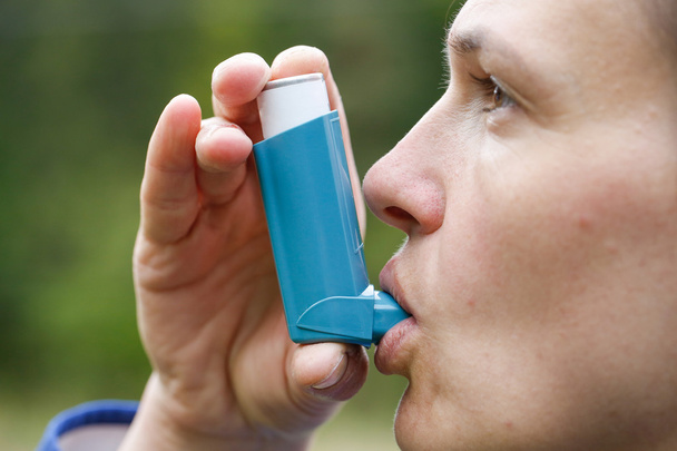 Asthma patient inhaling medication - Photo, Image