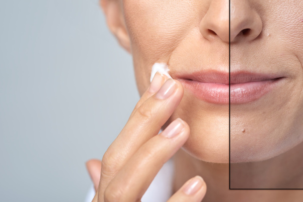 woman applying face cream on cheek - Фото, изображение