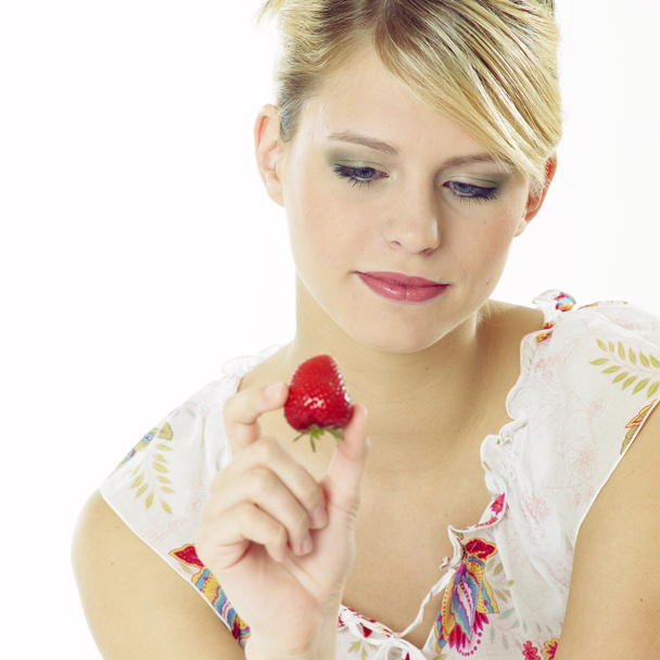 Woman with a strawberry - Photo, Image